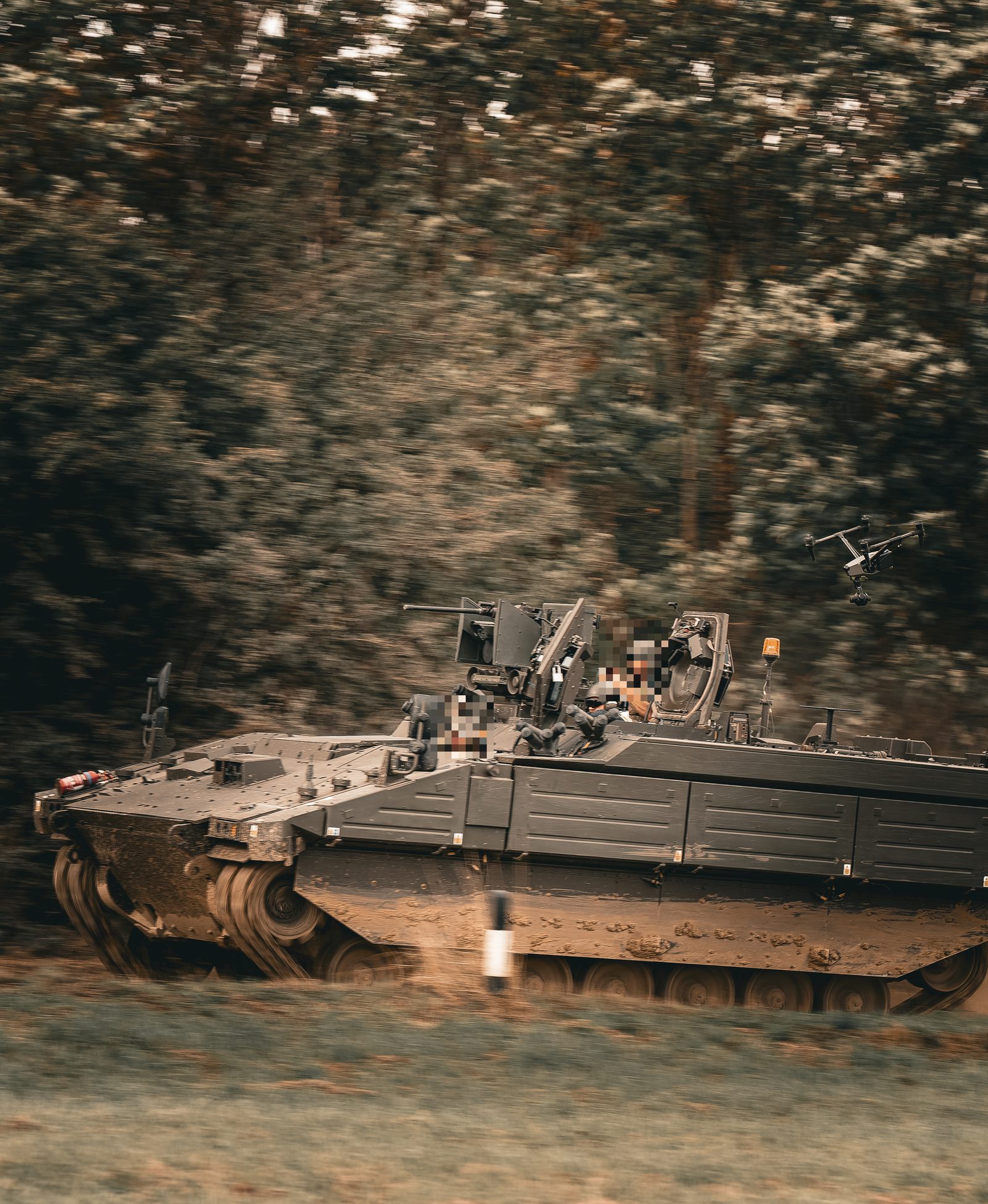 SkyGlide drone tracking an armoured vehicle at speed during trials