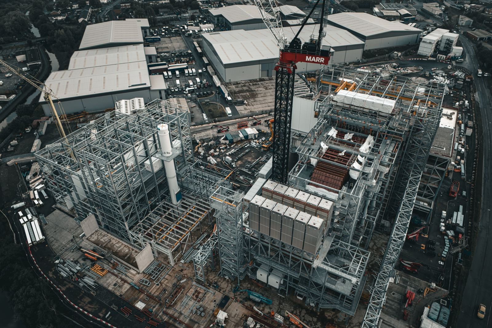 Aerial of energy-from-waste plant steelwork with tower crane